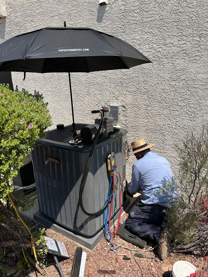 HVAC technician performing outdoor AC maintenance in Conway